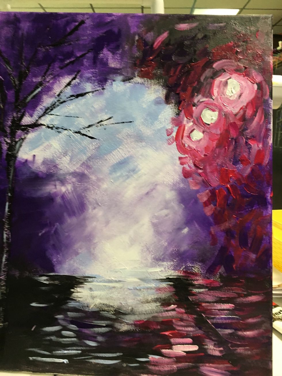 Add some black paint to the converging lines. It doesn't need to be perfect, It's a wet, reflective street.