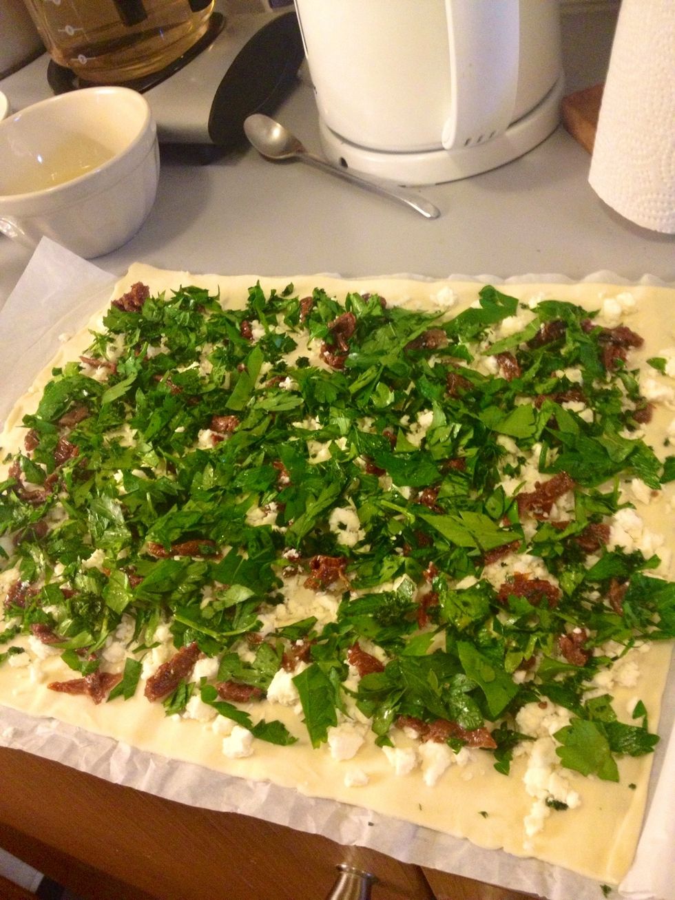 Add some black pepper on top, and then roll the dough from the long side.
