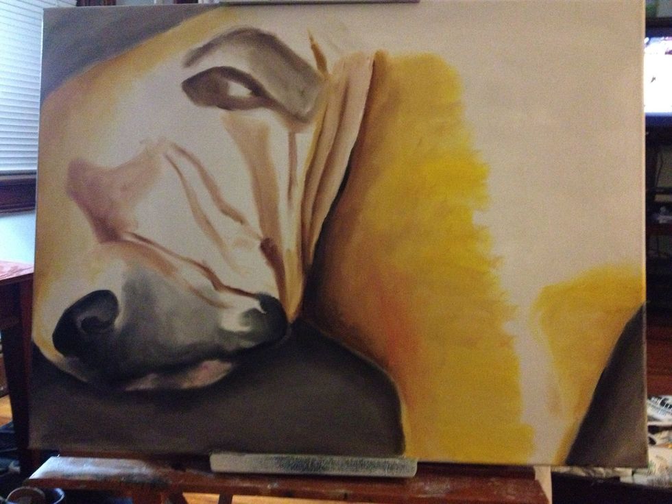 Add some black to your clean index finger and add the darkest shadow right underneath Bender's body. Also block in his nose and mouth area. Sketch in his ear as well.