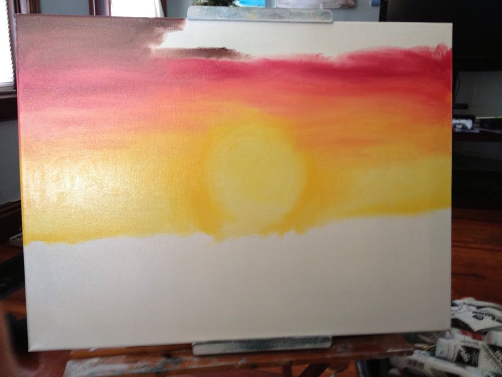 Add some bright red to your golden yellow to make an orange and start up the canvas. Continue up with just bright red, then a crimson, then a crimson and brown mix.