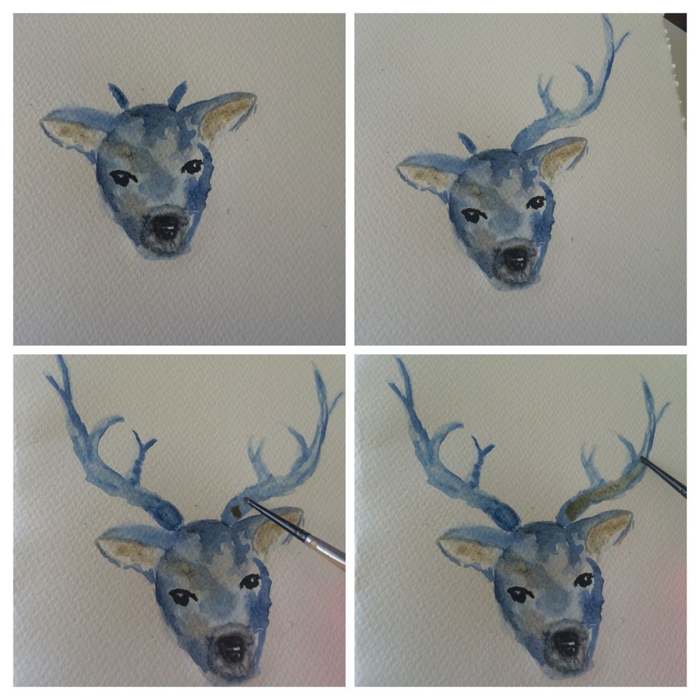 Add some brown to the ears and over the black to add depth. And start the antlers dont worry if the antlers arnt the same. Overlap the blue base colour with brown