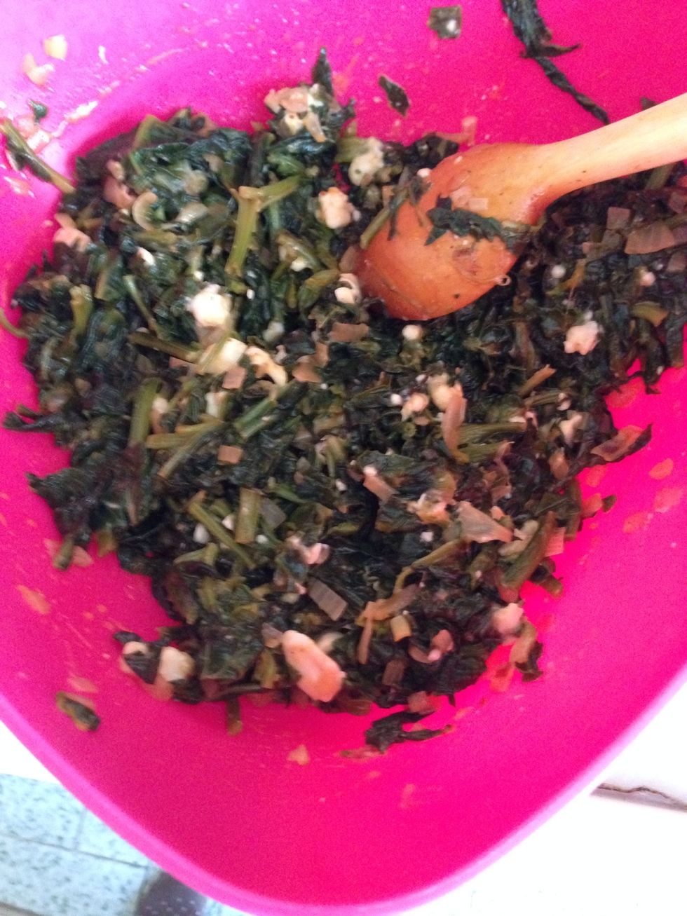 Add some cheese into the cooked spinach