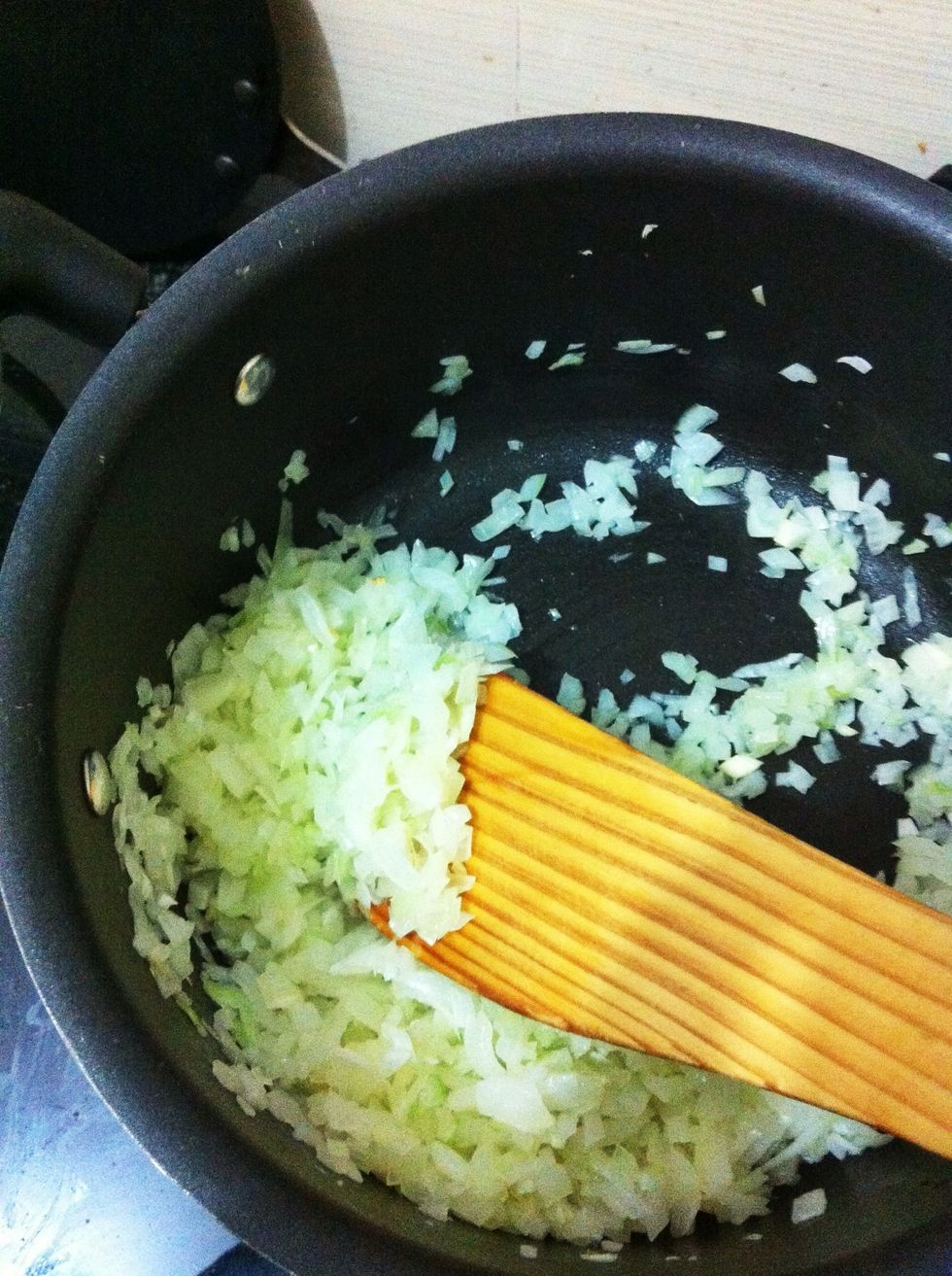 Add some cooking oil in a pan and add the chopped onions. Cook the onions till they are golden brown. Now add the 'wet paste' to the onions and keep stirring till the mixture turns brown(from red).