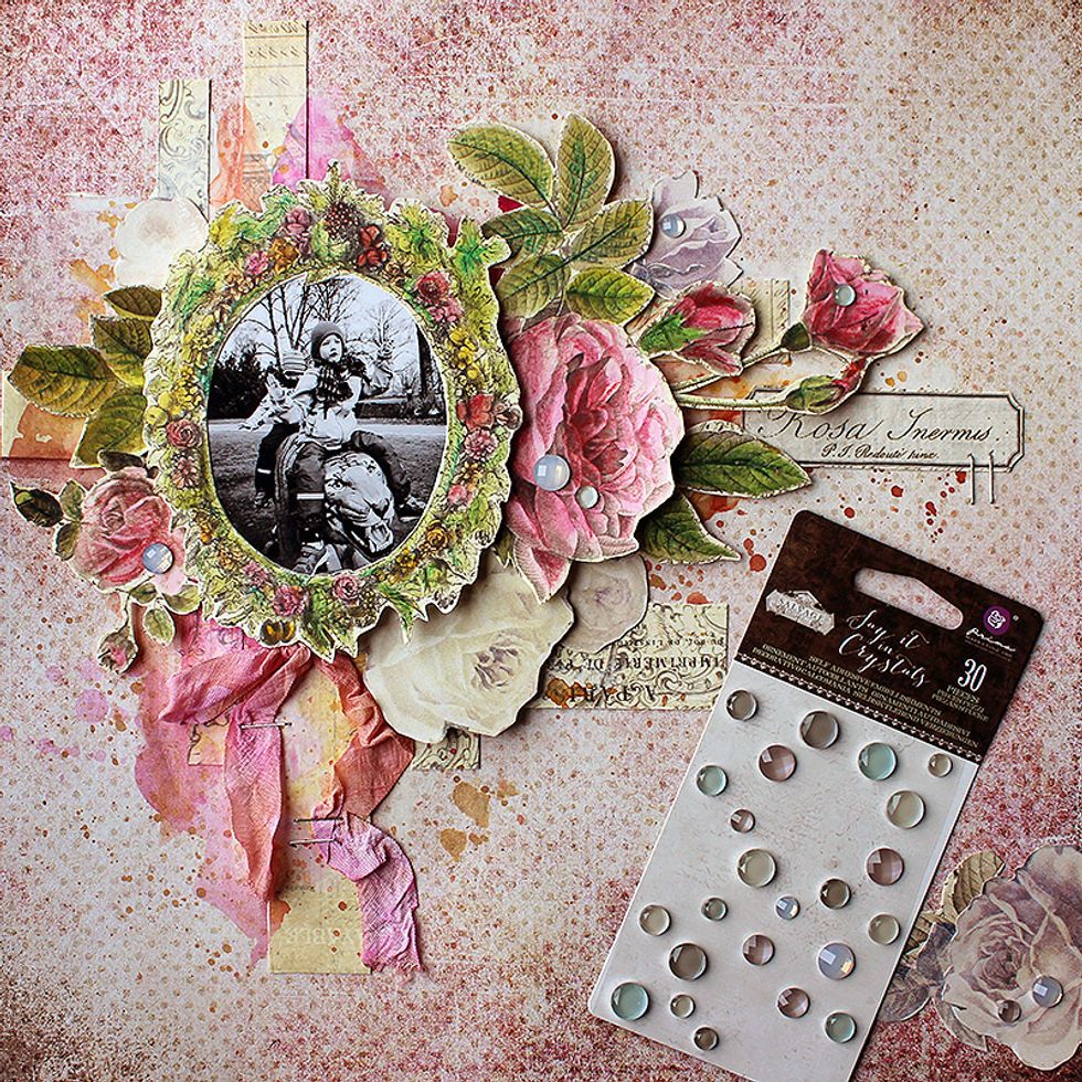 Add some details to the page \u2013 like \u201cdew drops\u201d to the flowers using the Salvage District crystals and a piece of seam binding colored with watercolors.