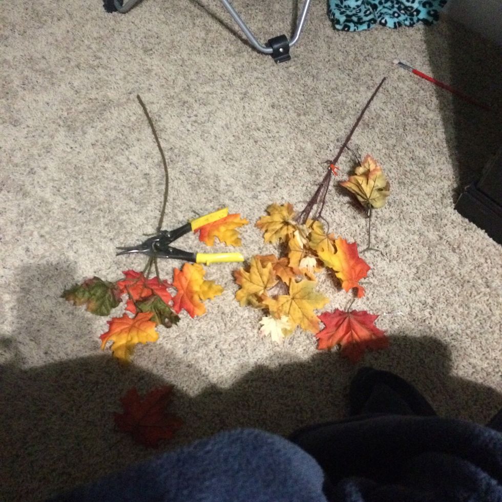 Add some fake fall leaves and decorations. The stems were to long so you can cut them down to fit into the jar