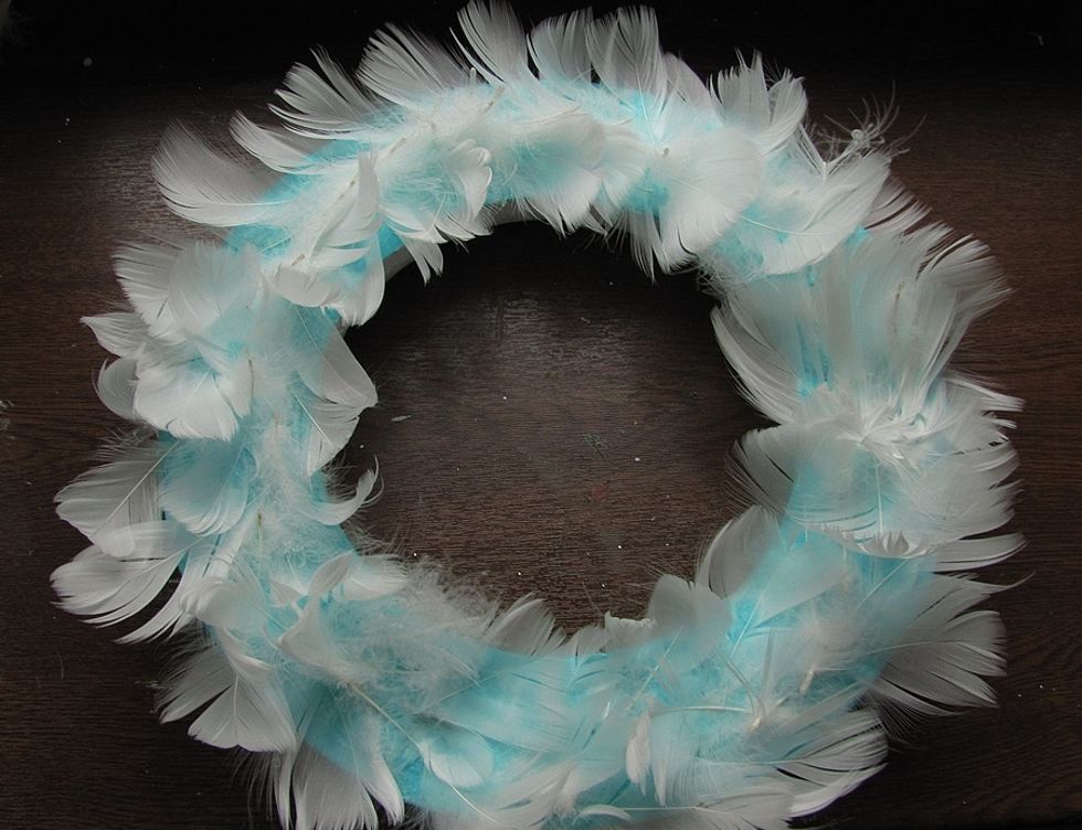 Add some feathers on the top. Let it dry.