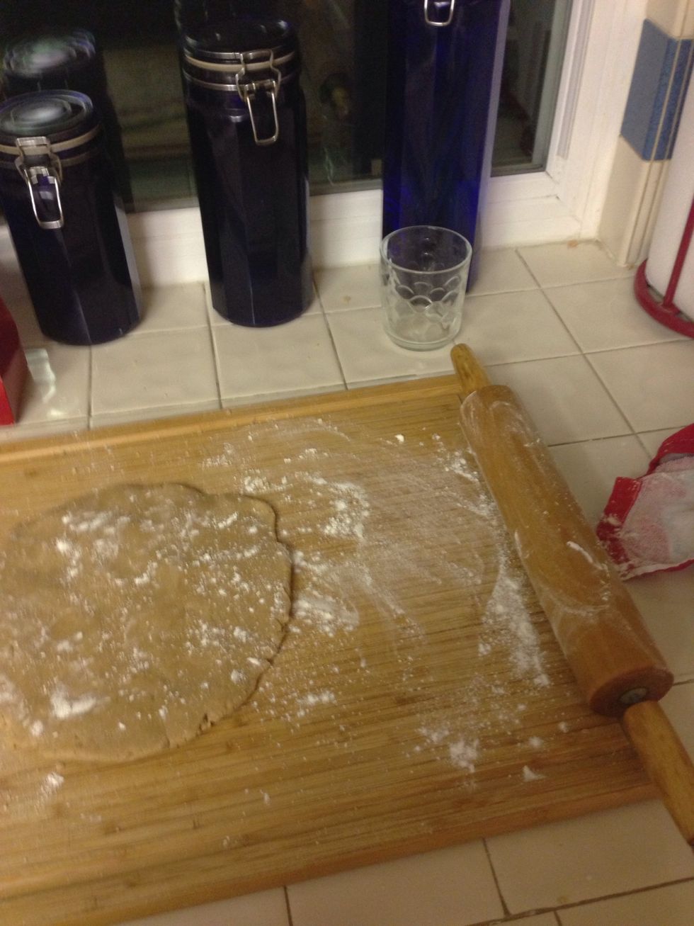 Add some flour to rolling pin and dough so it doesn't stick and start rolling your dough till its 1/4 thick.