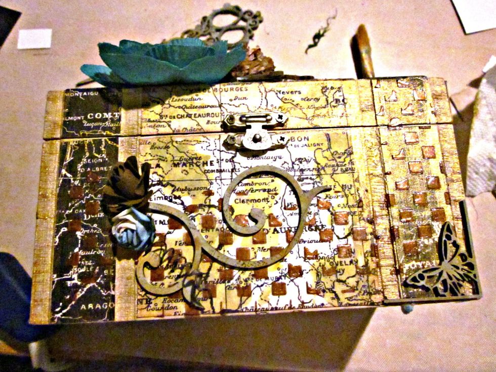 Add some flowers and chipboard embellishments on the box