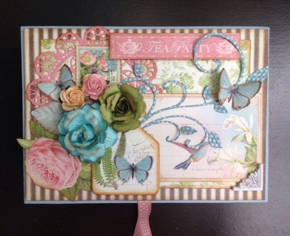 Add some flowers and there you have it! The finished cover.