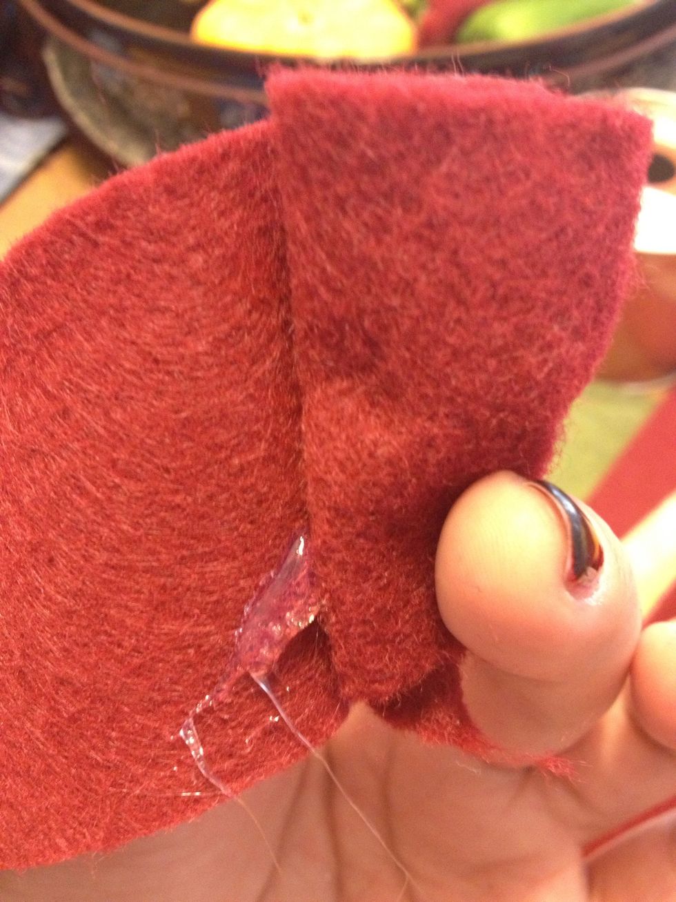Add some glue from your hot glue gun to keep it together.