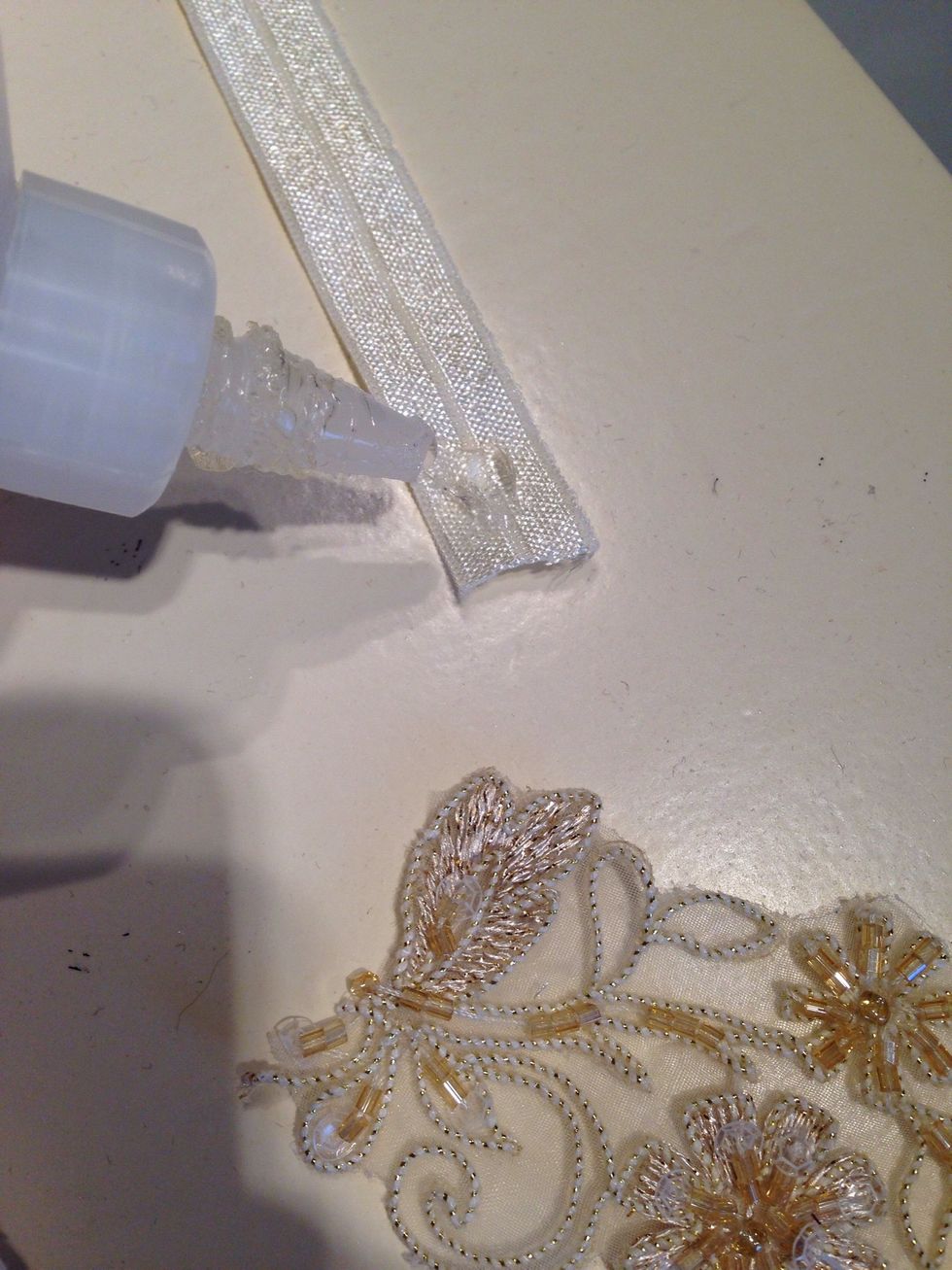 Add some glue or hot glue to the end of your elastic.