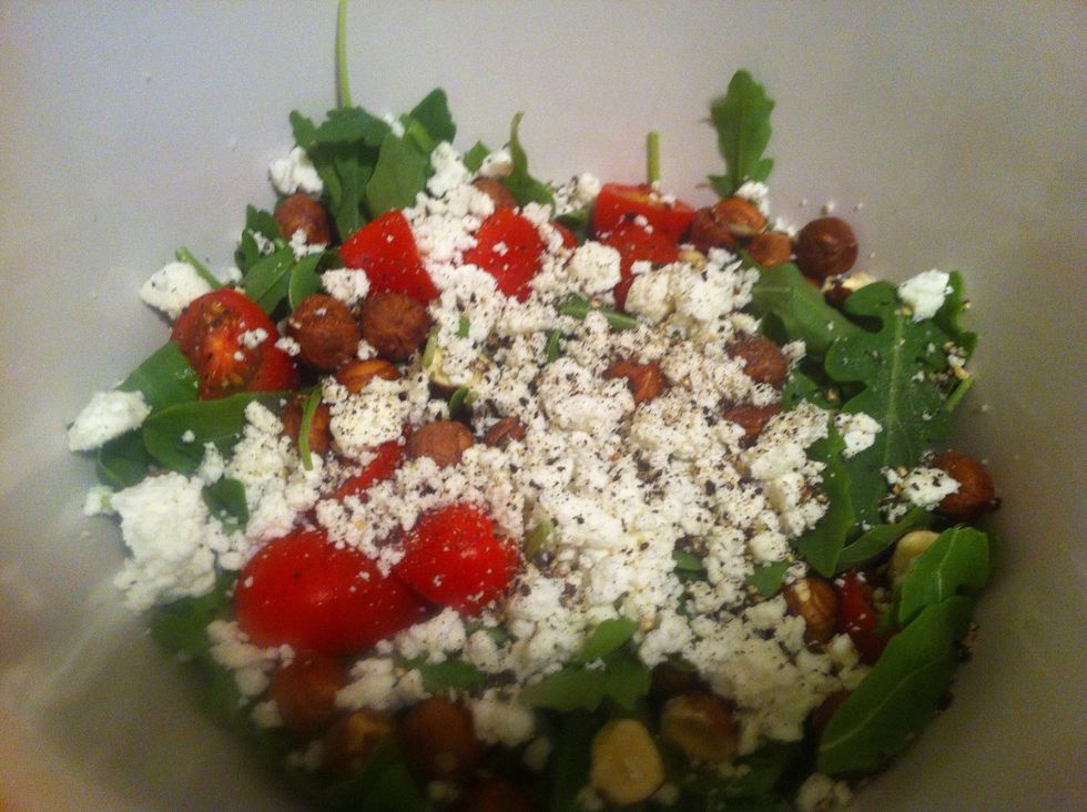 Add some goat cheese (embrace!) and a pinch of salt and a good bit of fresh ground pepper. We're gonna dress it right at the end so it's not soggy. Back to the chicken!