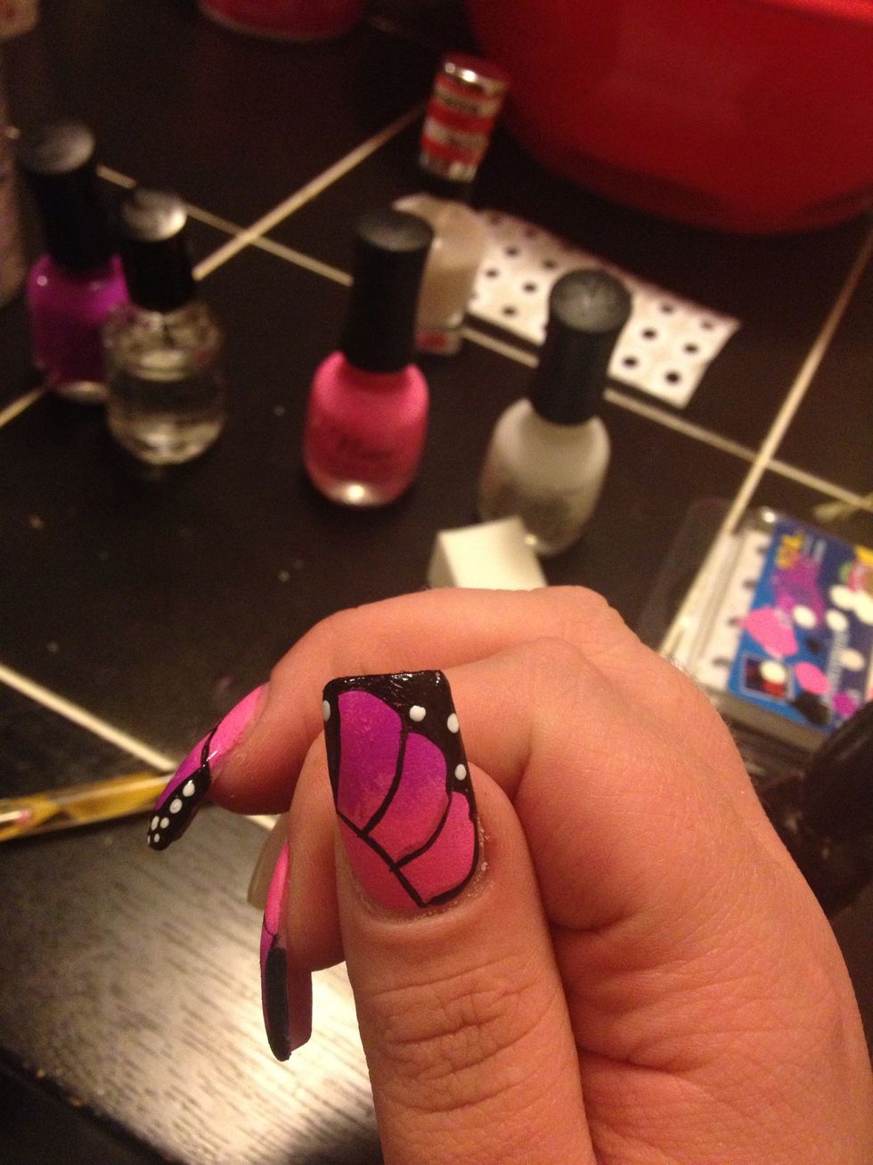 Add some large white dots using a toothpick or dotting tool