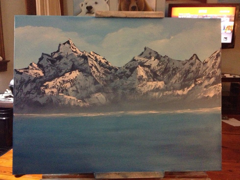 Add some liquid white to your palette knife for the waves crashing the land.