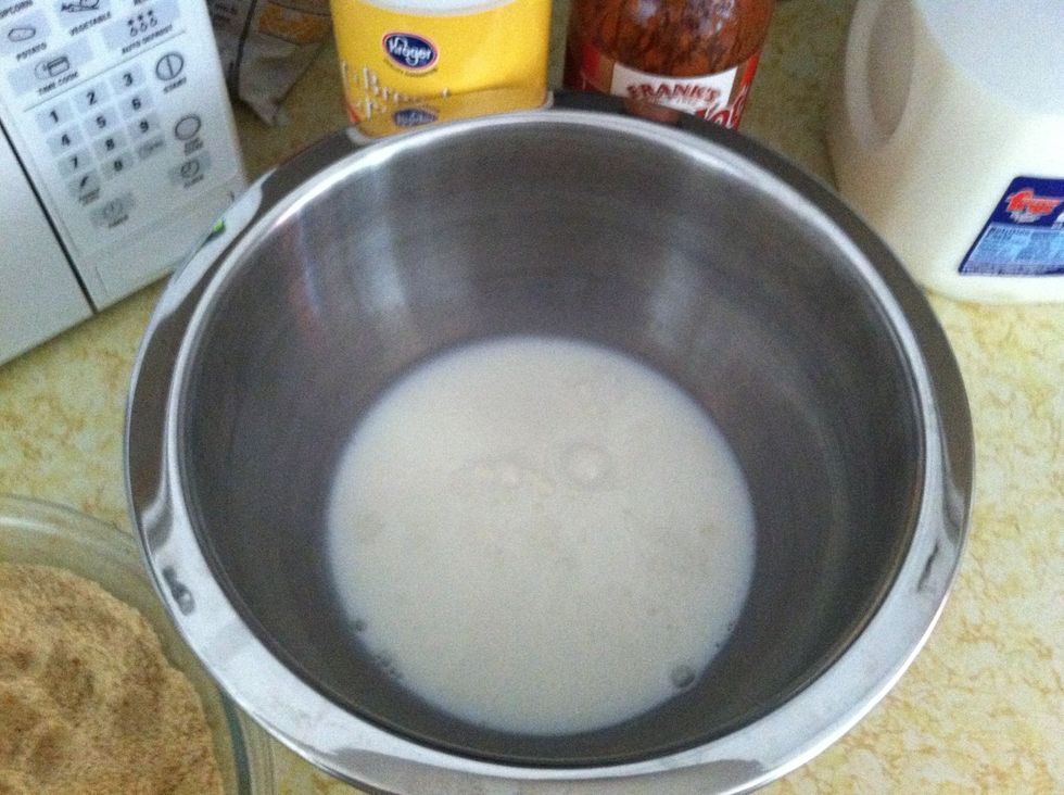 Add some milk to a bowl.