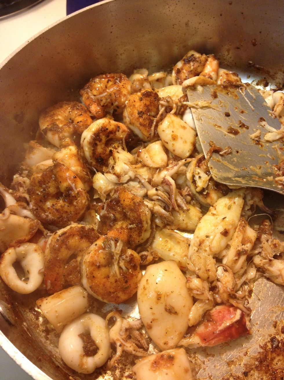 Add some more oil and cook the squid the same as shrimp, only 40 seconds a side. Remove and rest with shrimp. Add crab meat for a minute  just to heat up, rest with others covered off heat.