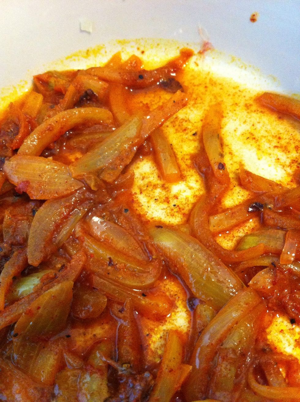 Add some oil and onions to a pan.When mellow add tablesspoons of tumeric tandoori corrriander jeera chilli powder some cardomin cracked pepper & aniseed pieces. Oh some salt too.