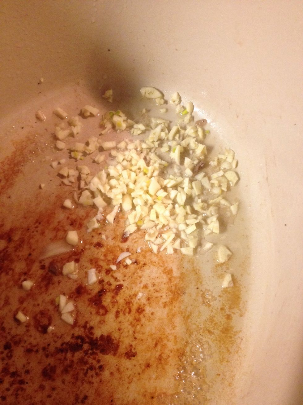 Add some olive oil and brown the garlic