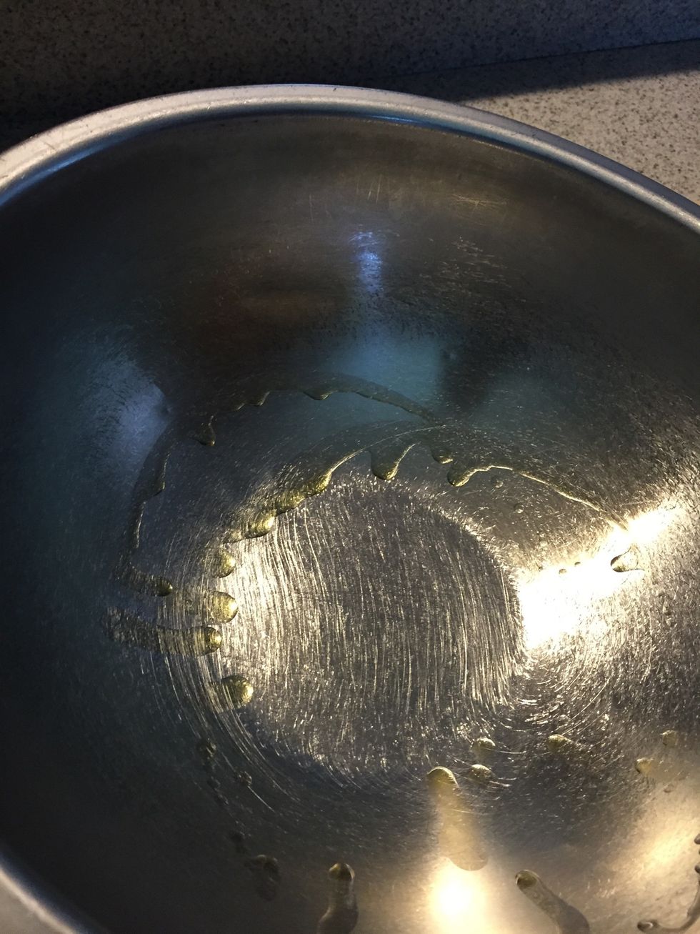 Add some olive oil to a bowl and coat all sides of the dough.