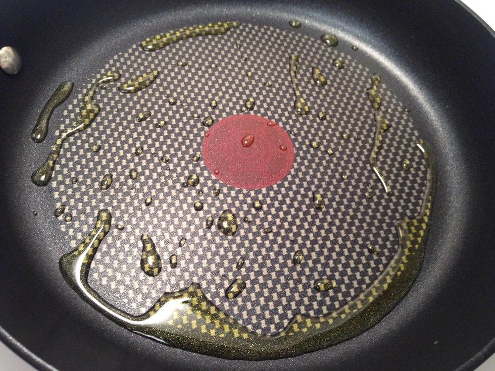 Add some olive oil to a HOT pan. You won't sear it properly if the pan isn't HOT