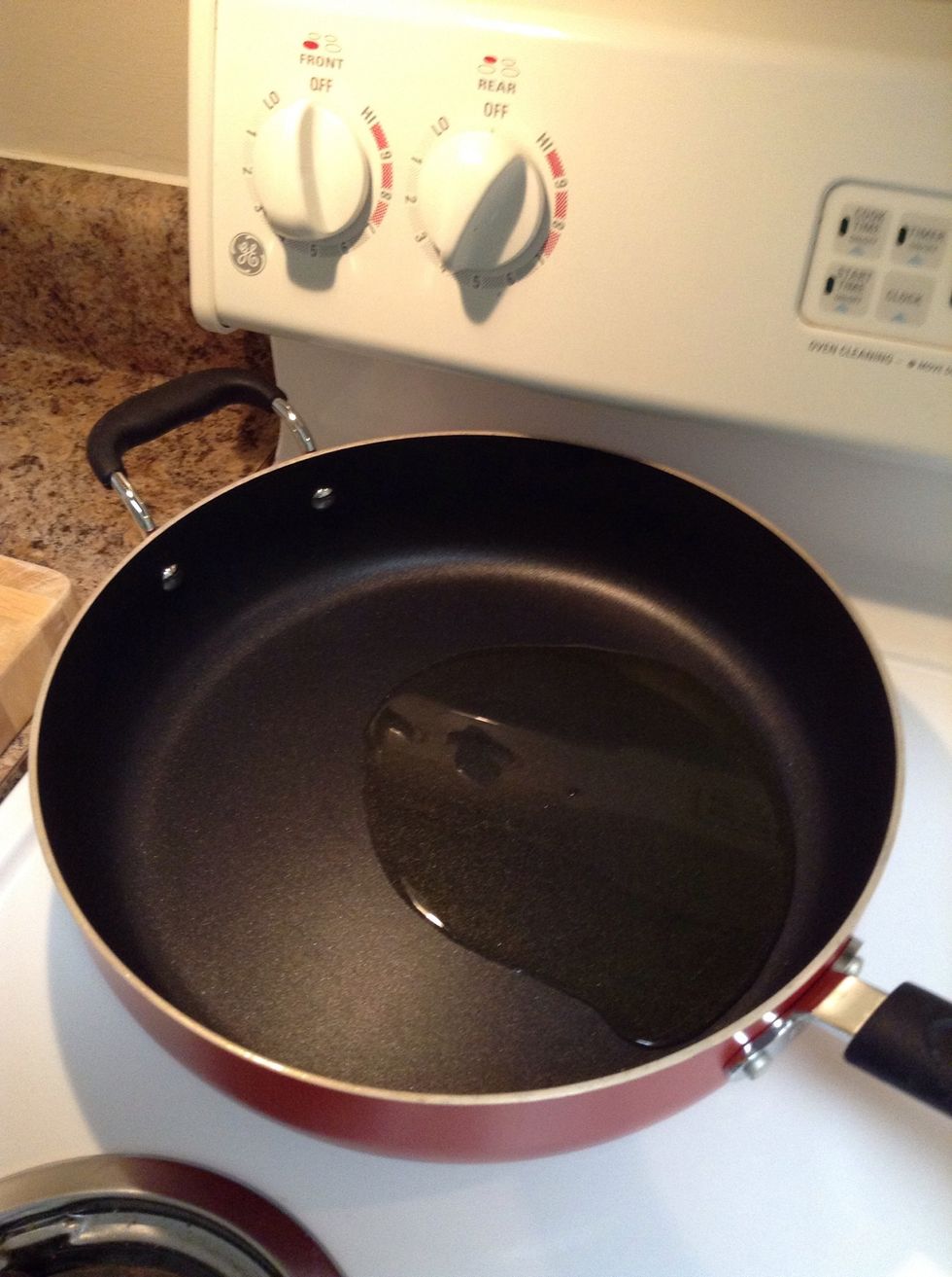 Add some olive oil to the pan (with a cover) on a low fire. It is very important as it will cook for a total of 1 hr and high fire will burn the veggies...