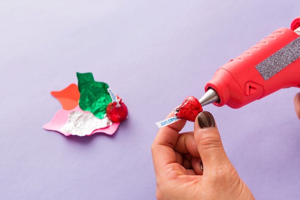 Add some red foil KISSES (aka your holly berries!) to the base.