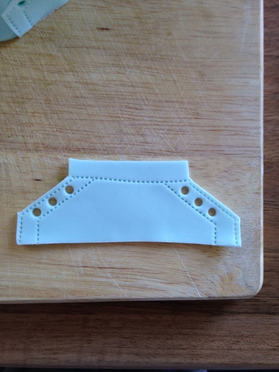 Add some 'stitch' detail to the shoe and holes for laces