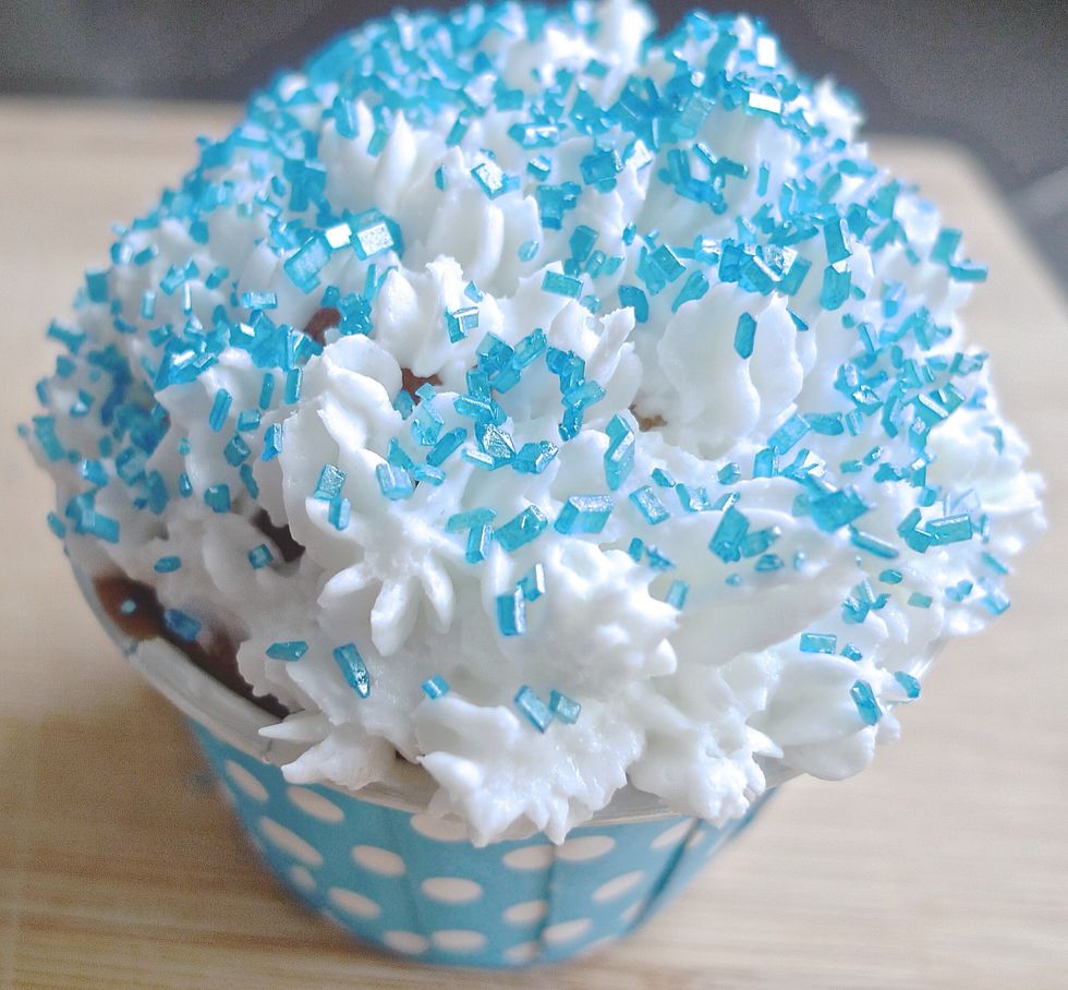 Add some sugar sprinkles on the top, preferably blue sprinkles, in line with 'FROZEN' theme.