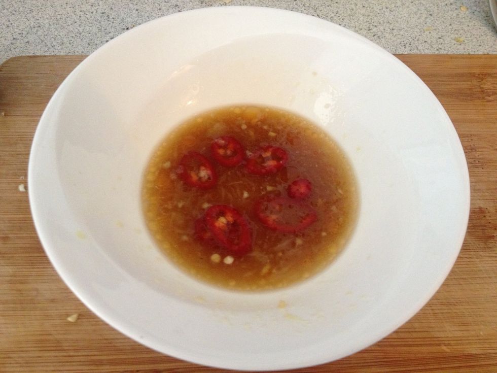 Add some thinly sliced red chilli