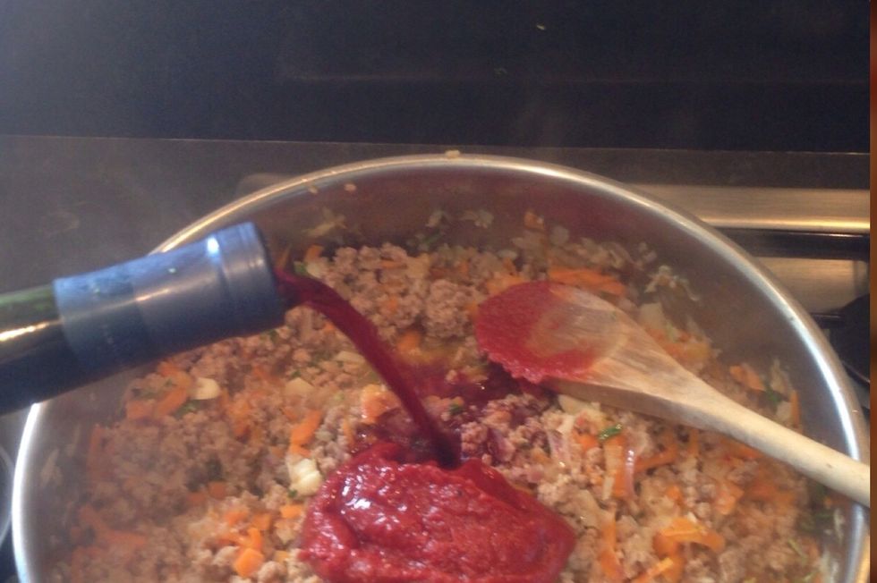 Add some tomato paste and pour some gluts of wine
