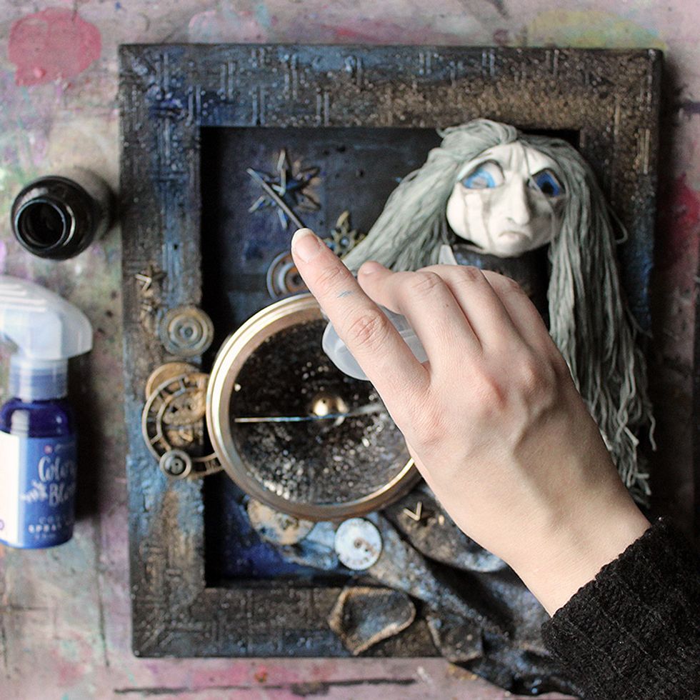 Add some touches of Color Bloom spray here and there. I sprayed Cobalt on the piece, and used the nozzle/tube to flick Precious Stone on the piece.