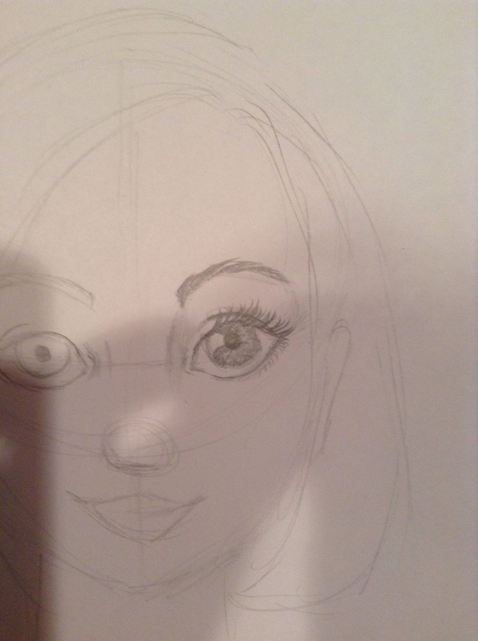 Add some whispy eyelashes and some very small faint ones on the bottom corners. Shade from the nose bridge to the inner corner of the eye. Repeat these steps on the other eye.