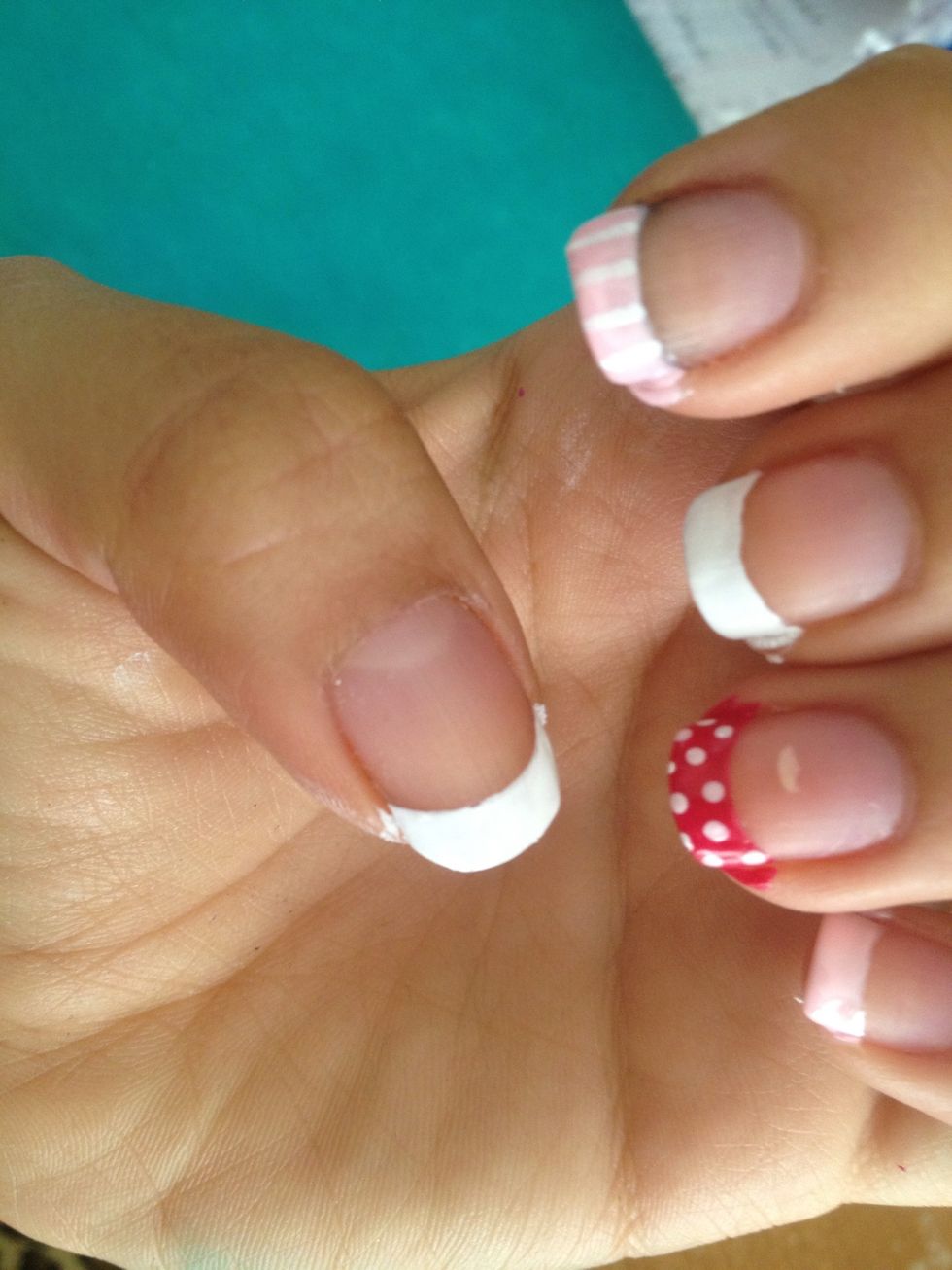 Add some white dots with the the toothpick on the nail with the dark pink nail polish