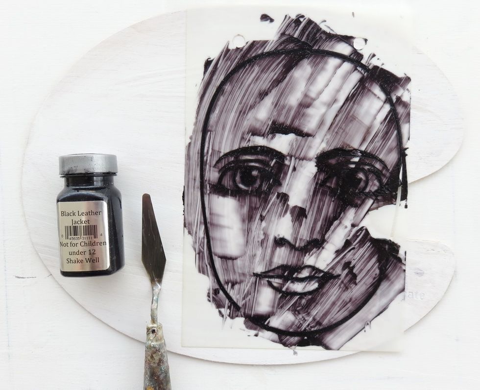 Add Sorbet Black Leather Jacket paint over one of faces from Let's face it stencil stack stencils. Make a thin cover as the lines are delicate.