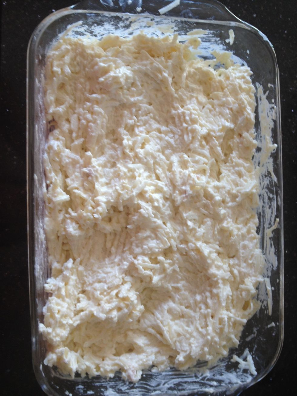 Add sour cream/cream of chicken mixture to the potatoes. Stir together to coat all the potatoes.