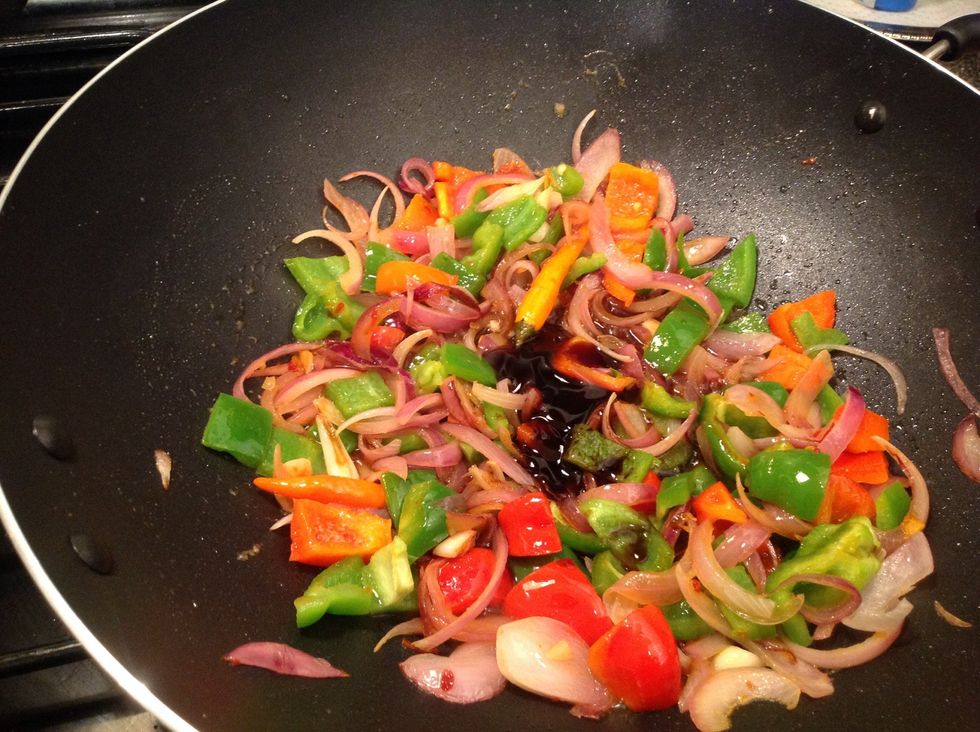 Add soy sauce and rice vinegar stir and cook for 1 minute. Add white pepper. Adjust the quantity of white pepper to suit your spice tolerance level.