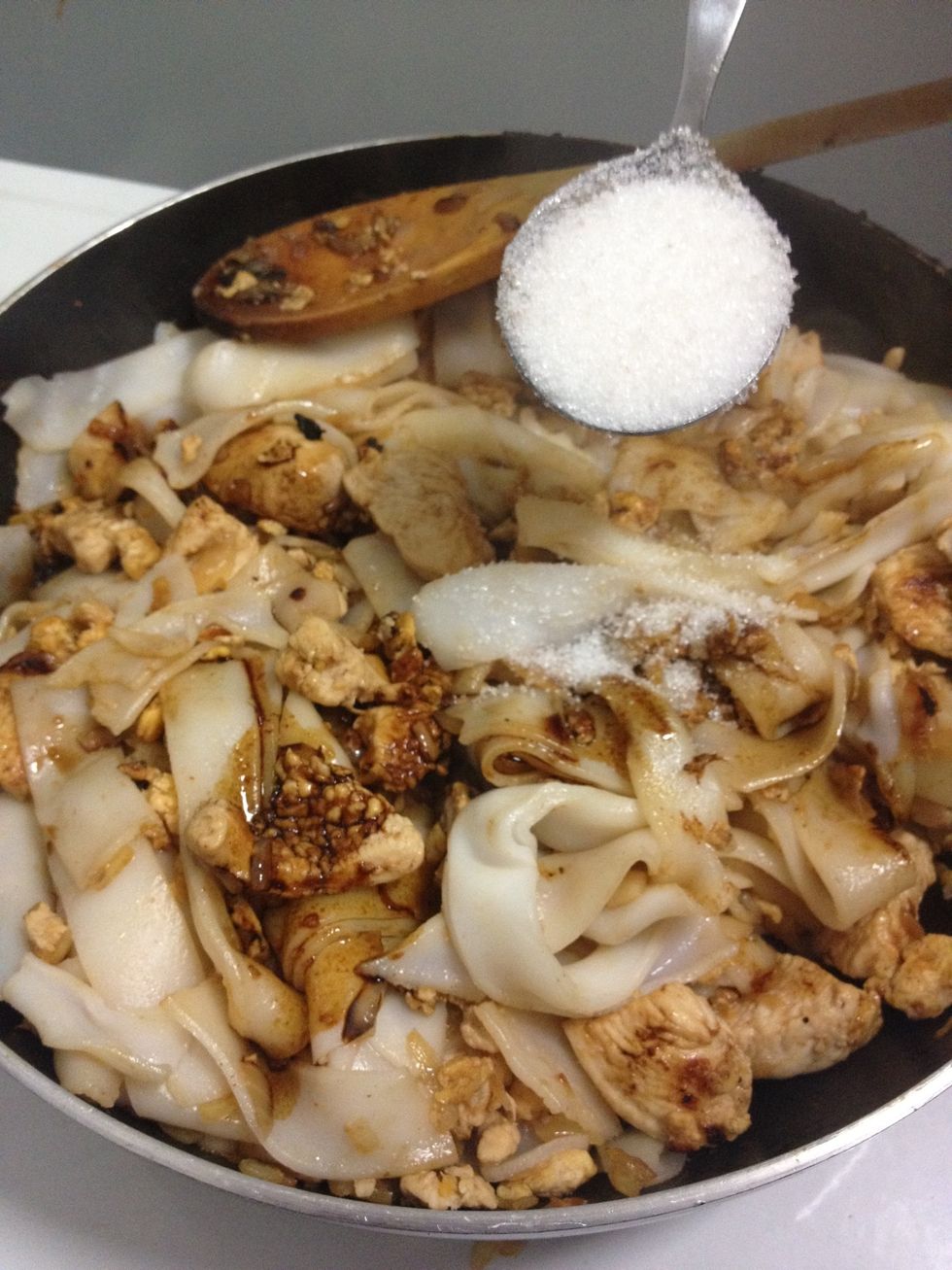 Add soy sauce and sugar and mix in. Turn heat down to medium.