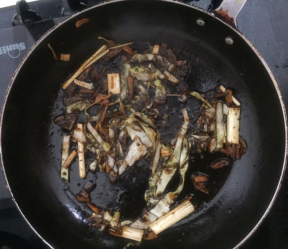 Add soya sauce and a pinch of pepper powder. Add a small amount of water and cook for 2 mins.