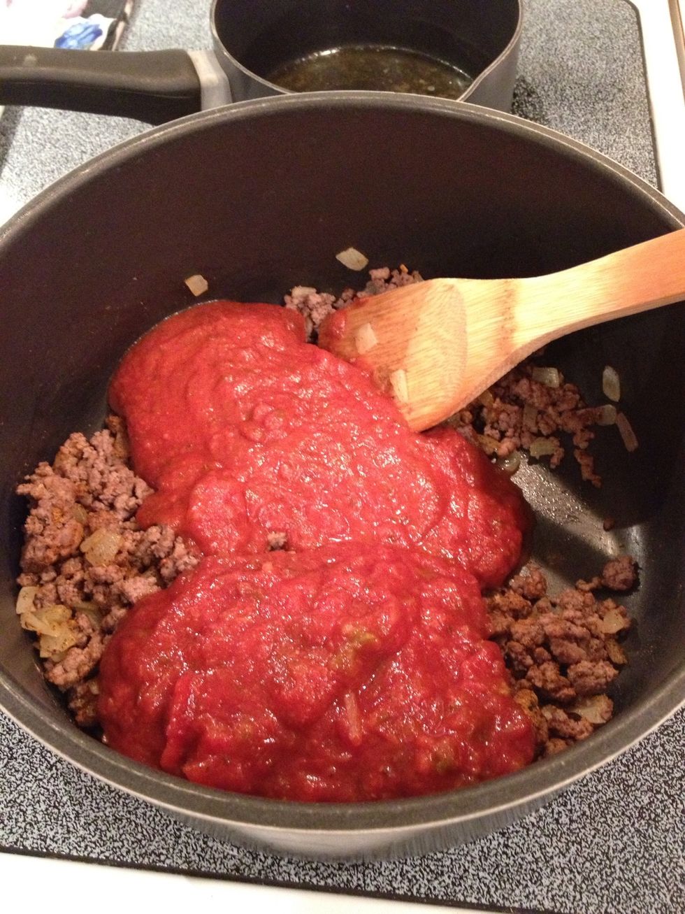 Add spaghetti sauce and salsa.  Stir well.