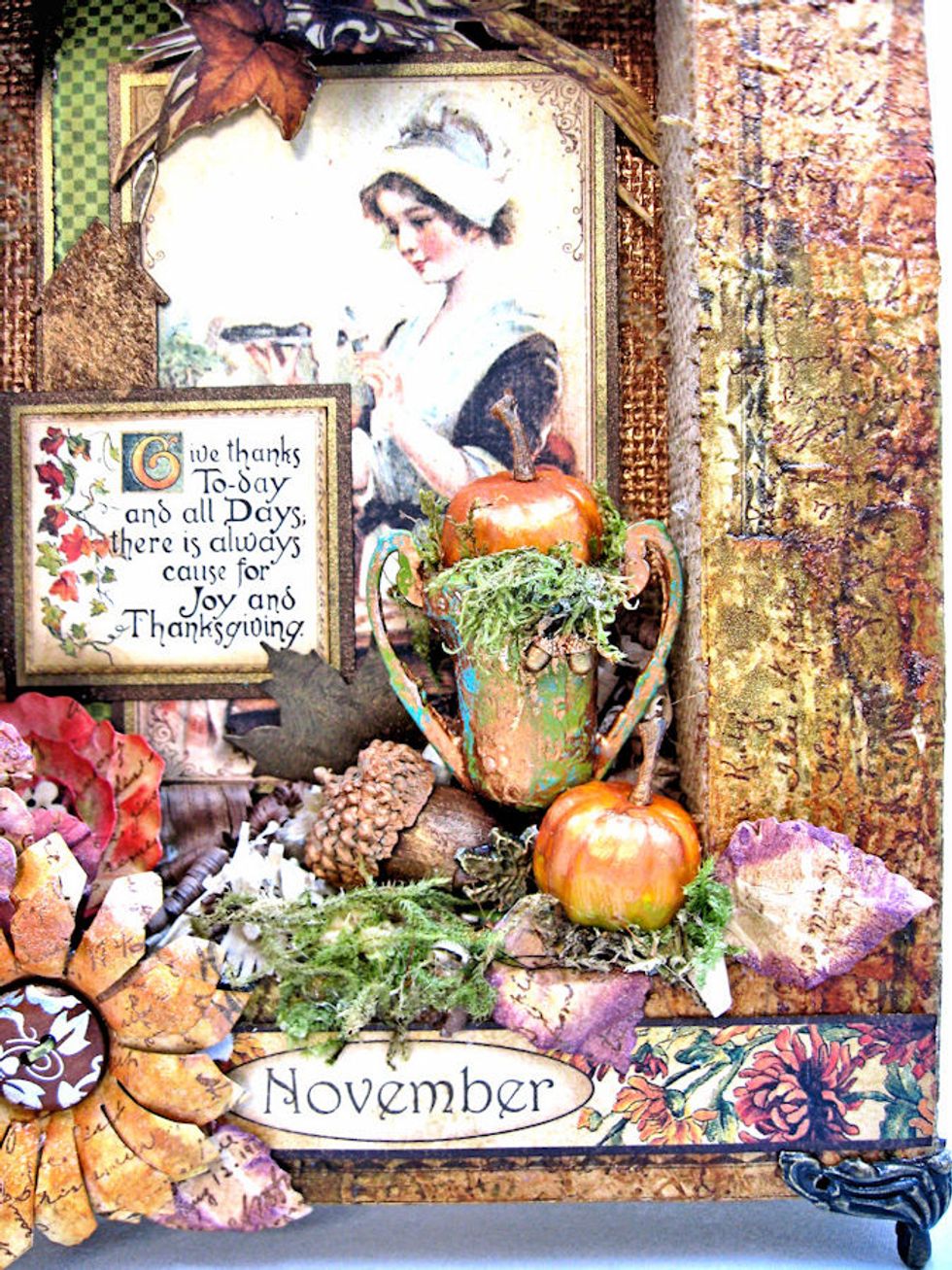 Add Spanish Moss to painted/distressed trophy. Glue pumpkins and acorns in place.