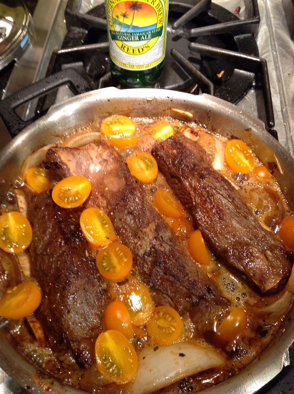 Add spare ribs back to empty cooker, add tomatoes, oregano and remaining spices, pour in Ginger beer & seal cooker.