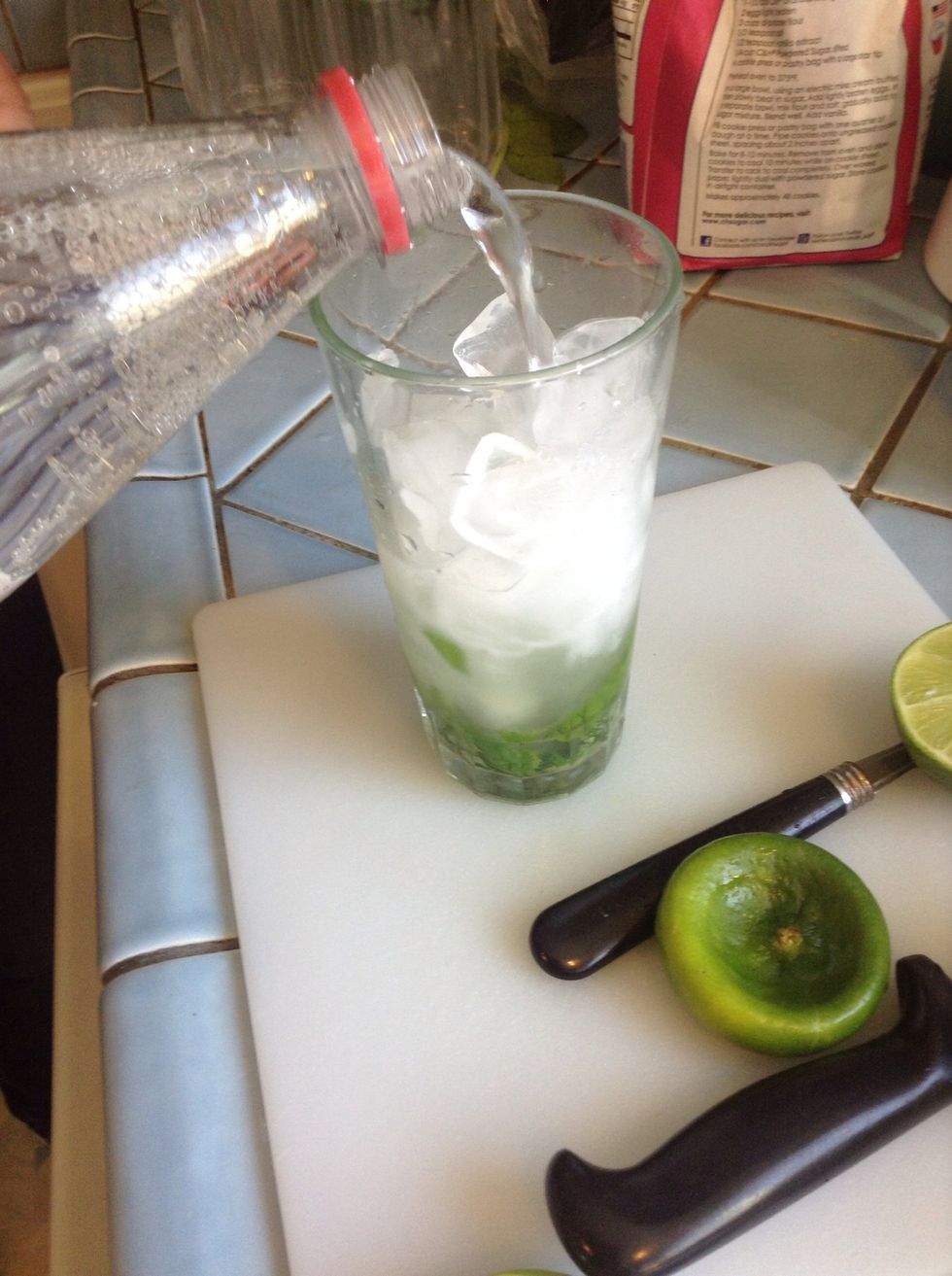 Add sparkling water - fill glass about 2/3 full.