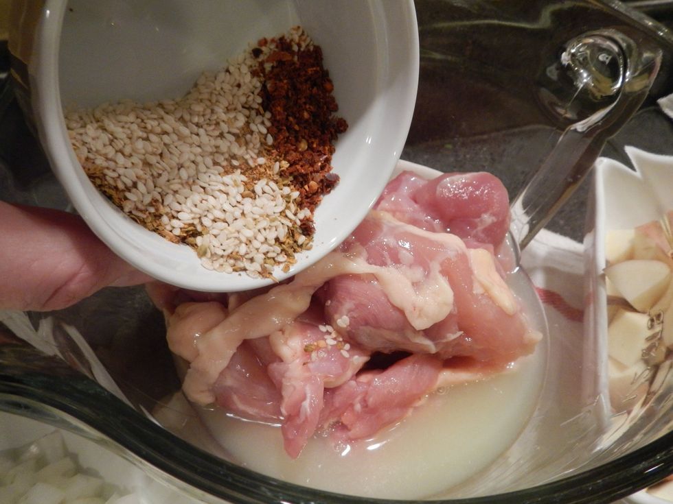 Add spice blend to chicken