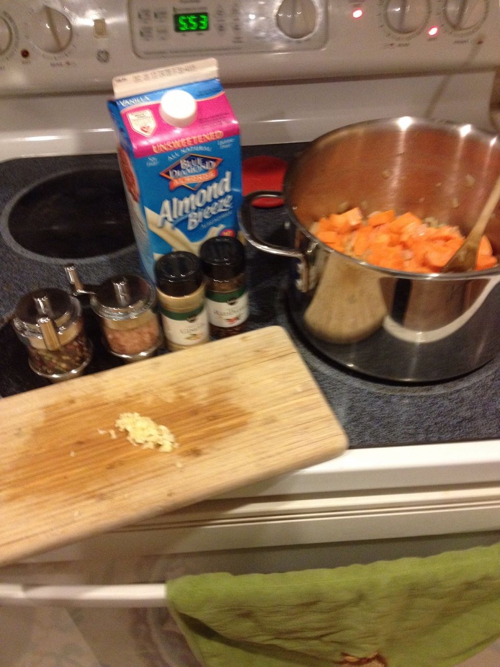 Add spices and almond milk.