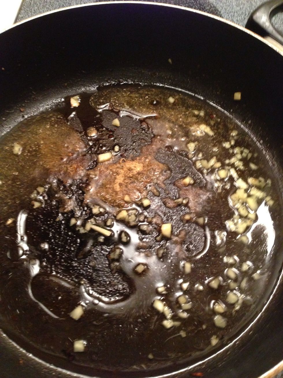 Add spices to pan with ginger and half of the water