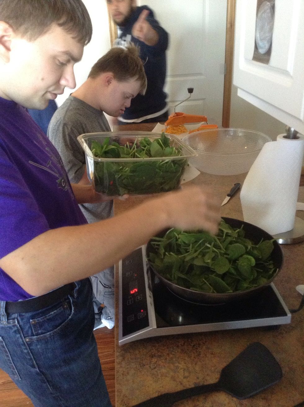Add spinach to skillet