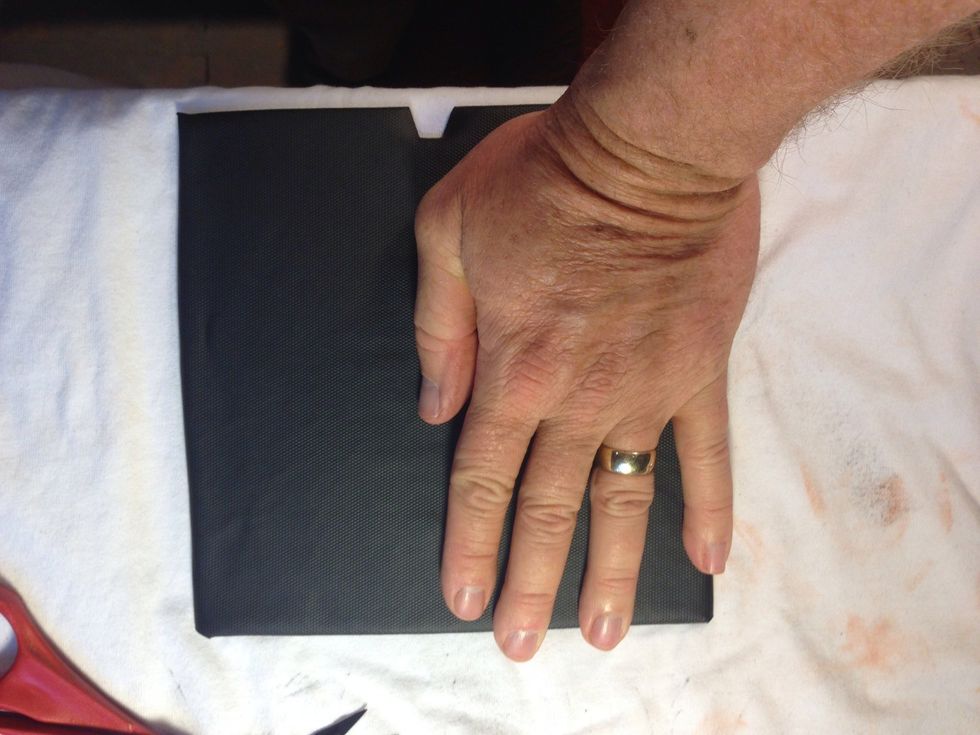 Add spray adhesive to back of felt and fold over and press firmly, you can add some weight to hold it down.