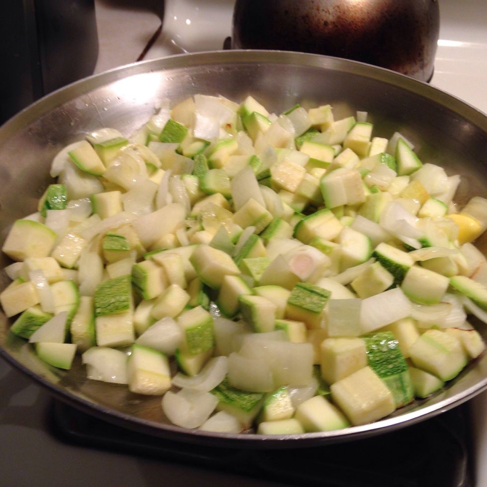 Add squash and onion to pan of medium heat and sautee.