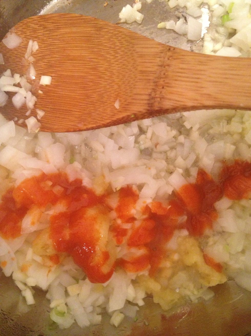 Add sriracha and lemongrass. Saut\u00e9 until fragrant.