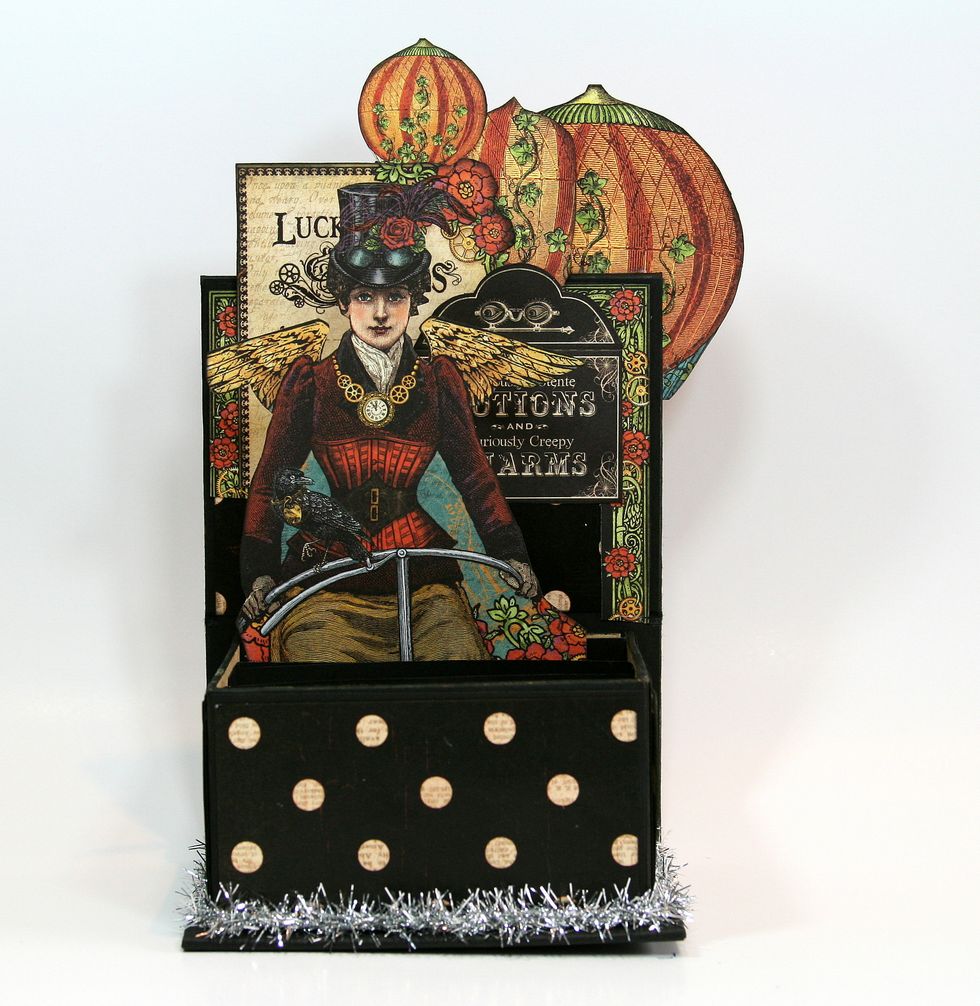 Add Steampunk woman image on first support closest to back.